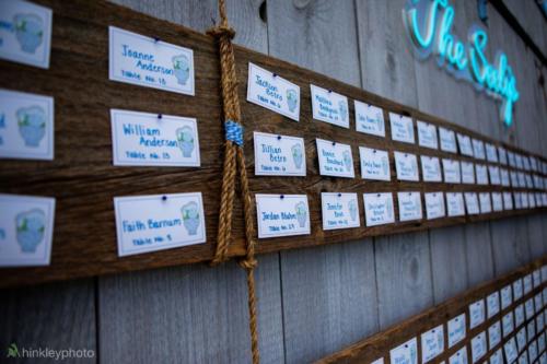Table seating chart afixed to the side of the barn