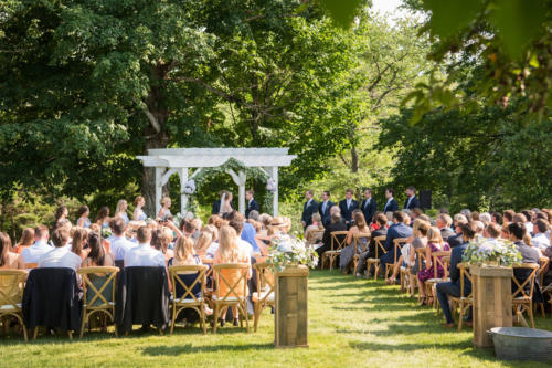 Guests comfortably seated in crossback chairs
